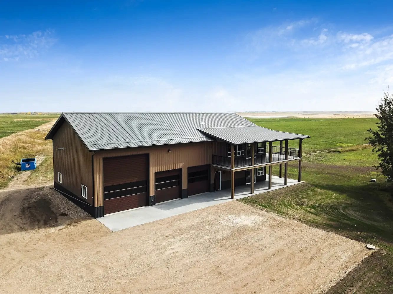 Brown barndominium shop home in the country