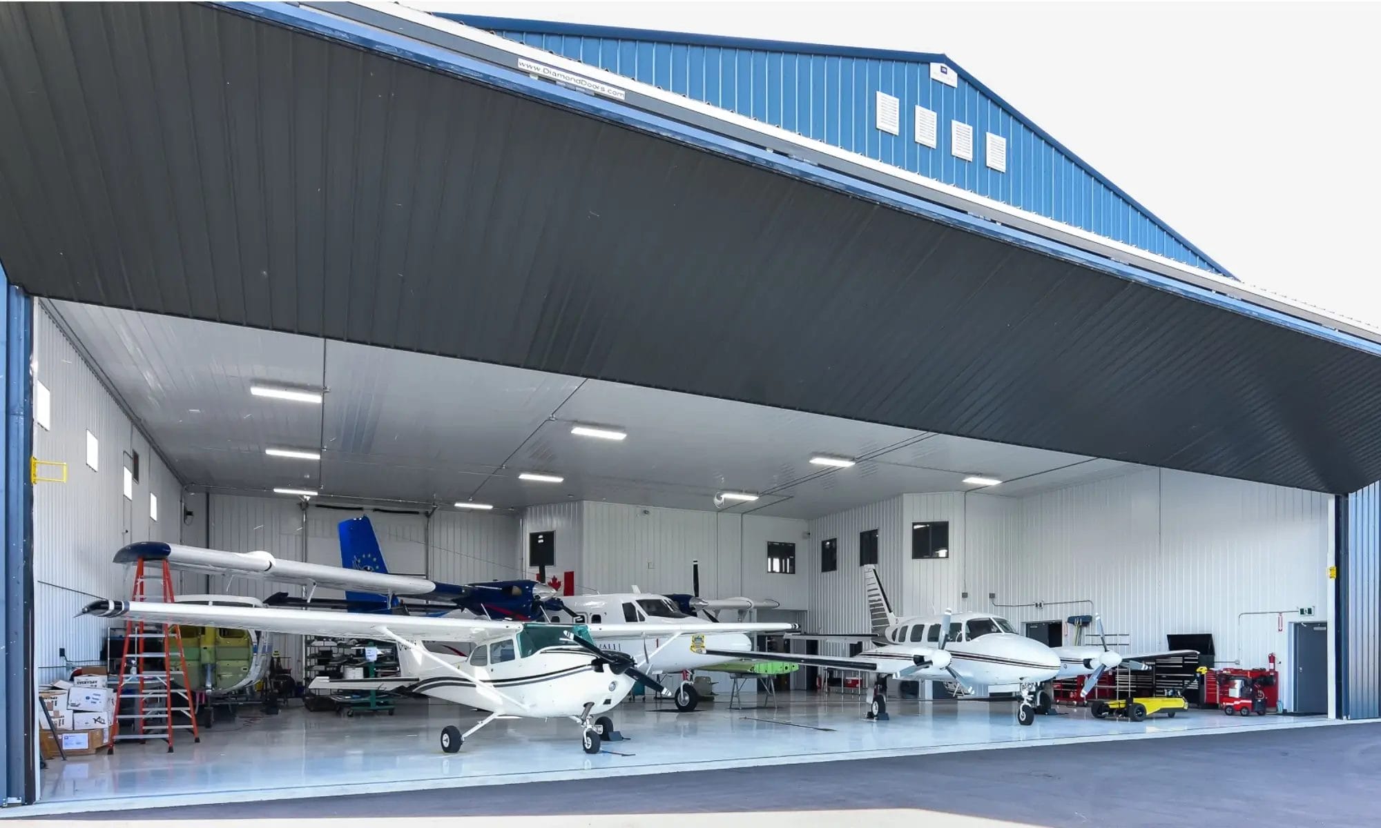 Custom post frame airplane hangar protects a small fleet of airplanes