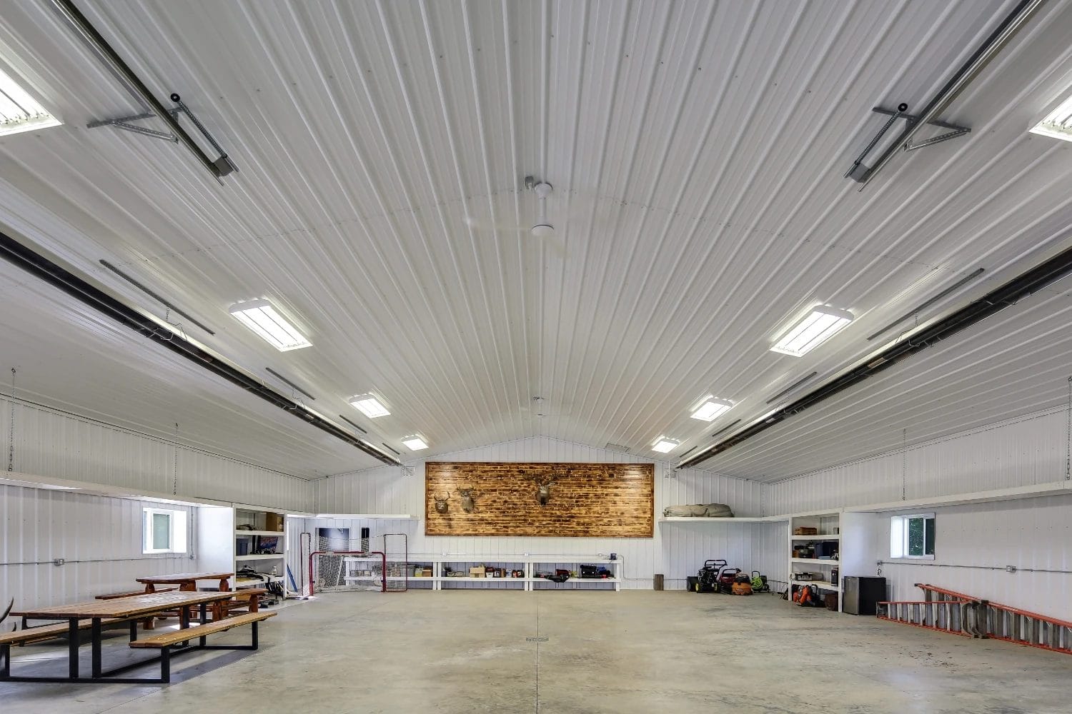 A monitor-style shop constructed with post frame methods create a clear span interior for flexible use.