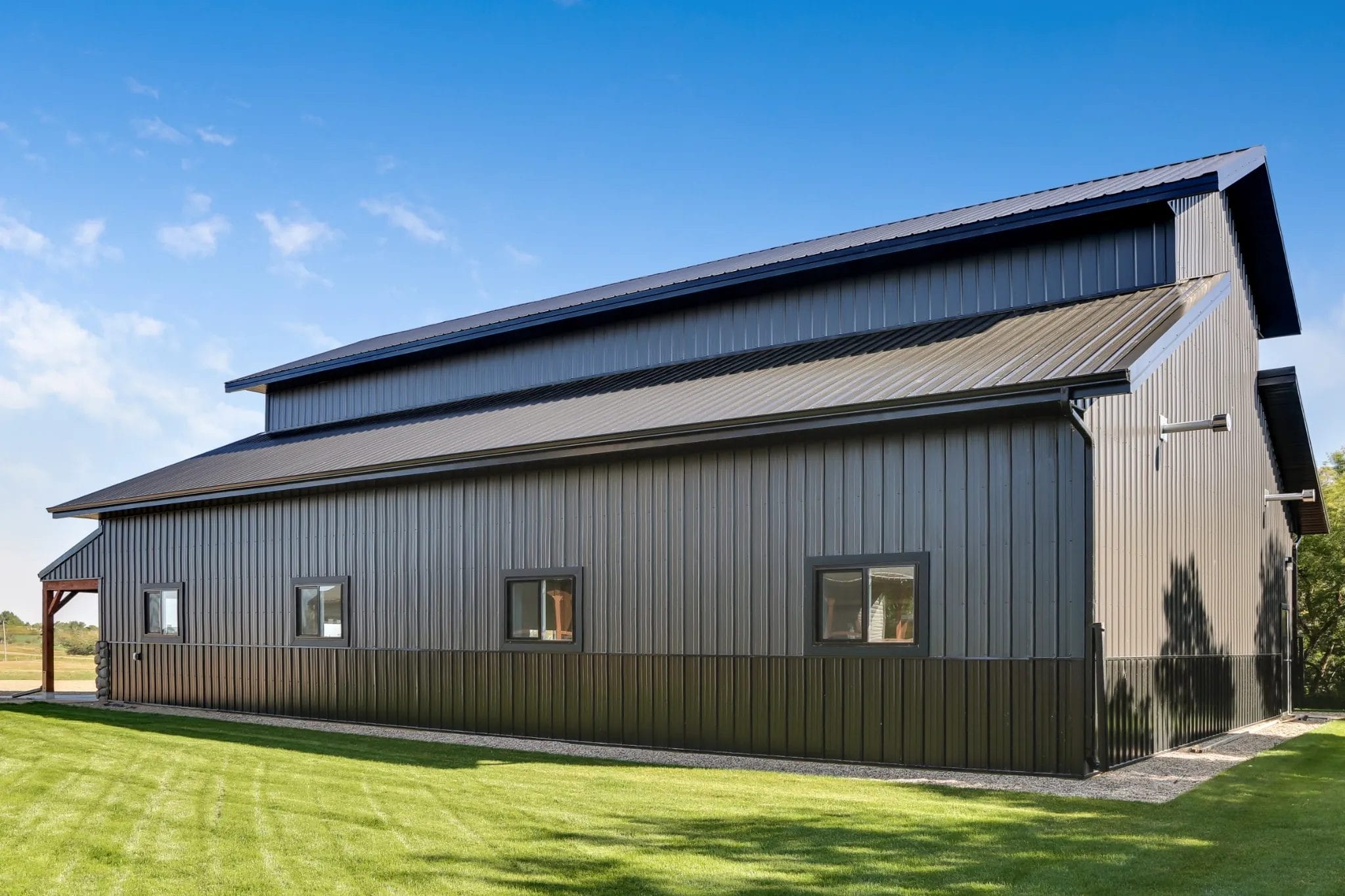 The side and back of a 44' x 60' monitor-style shop with wainscoting around the entire perimeter.