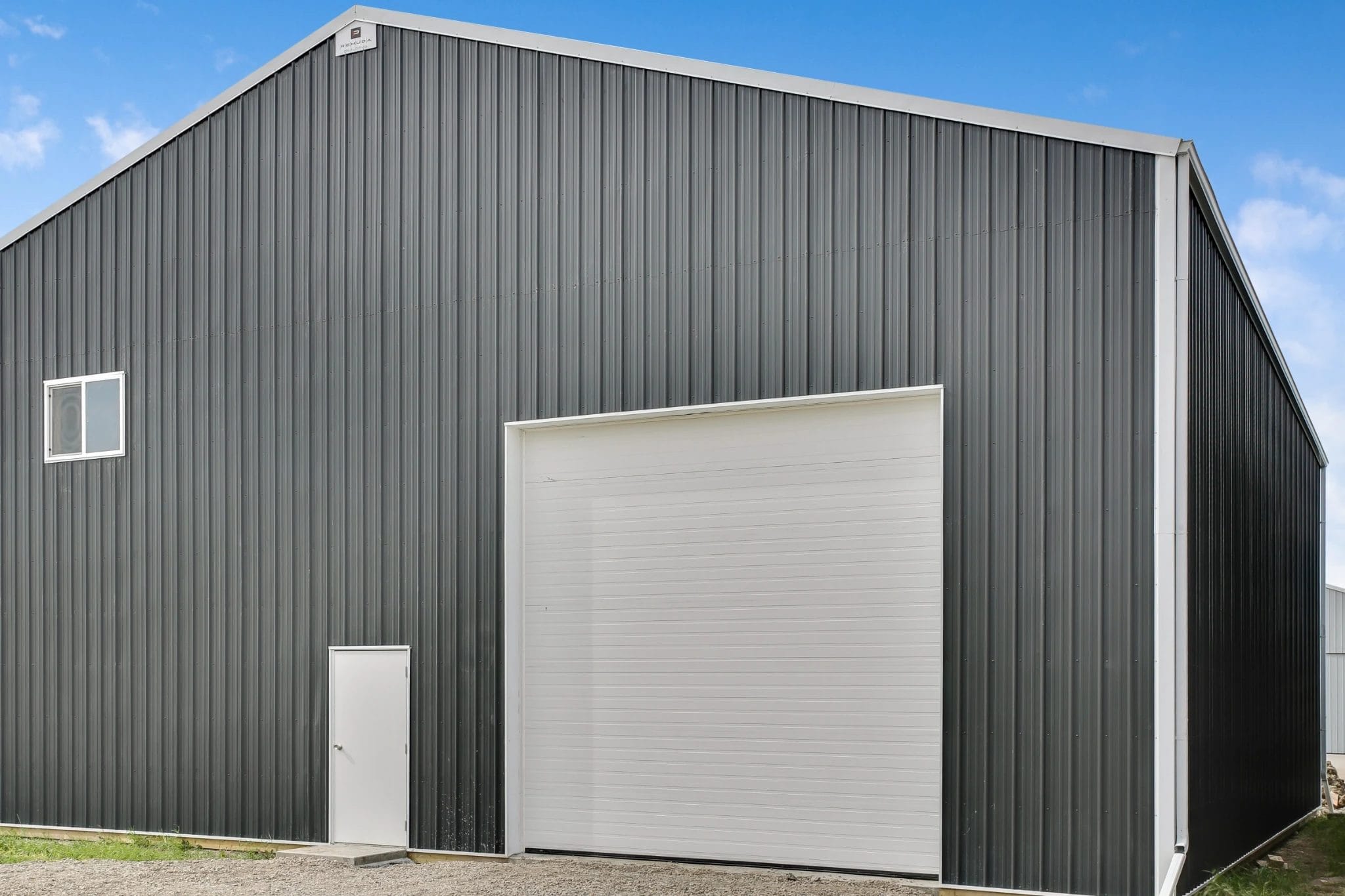 A post frame aircraft hangar at a small rural airport shields aircraft from damaging Western Canadian winter weather.