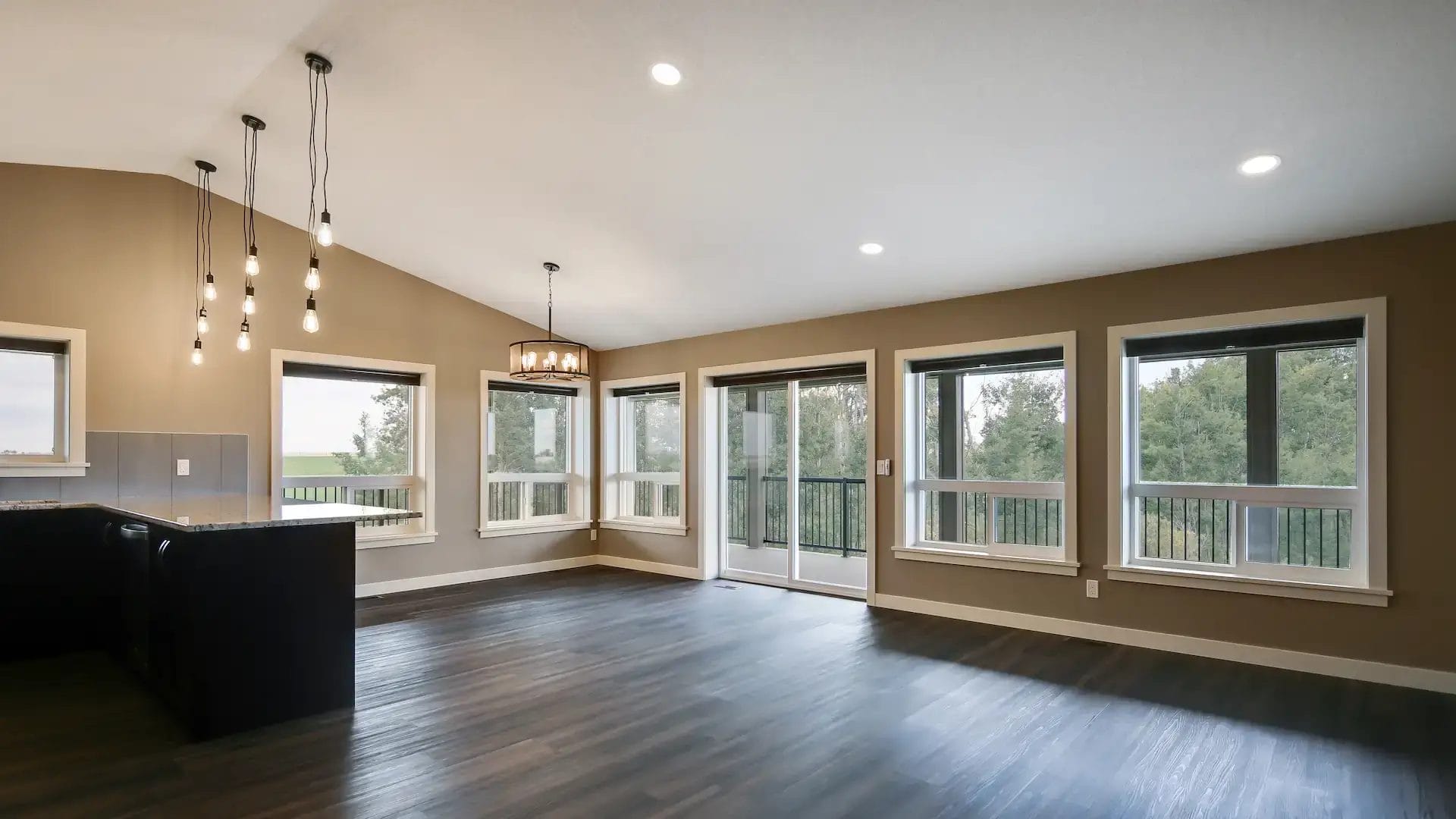 Two story barndominium living room with sliding glass doors leading to the porch