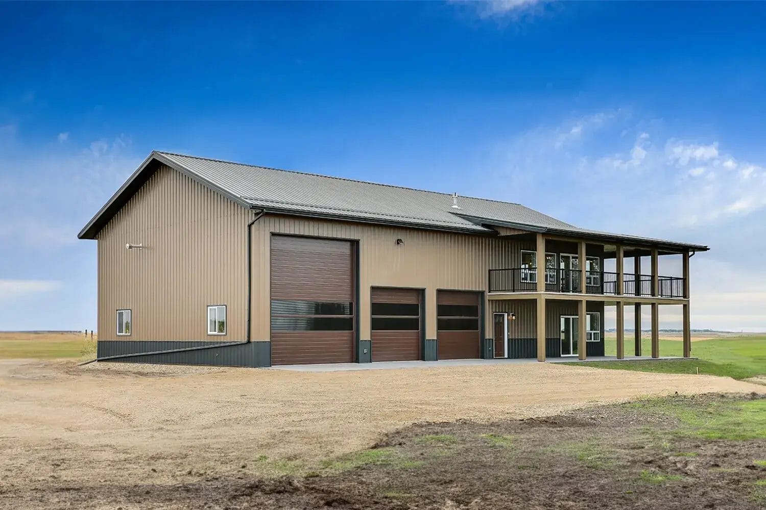 Brown two story barndominium with 40' x 72' footprint on a rural property