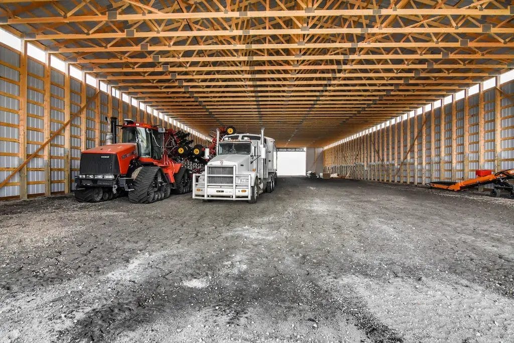 Tractor and grain cart parked inside 80' x 200' equipment cold storage building