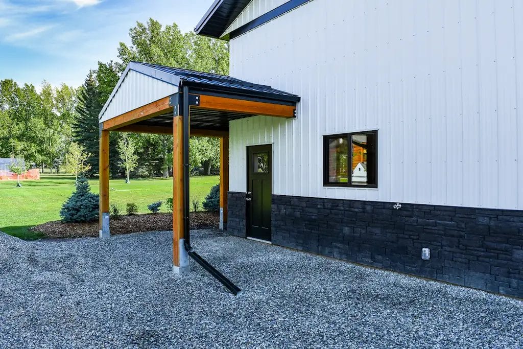 Covered porch leads into a 40' x 40' hobby shop with guest suite