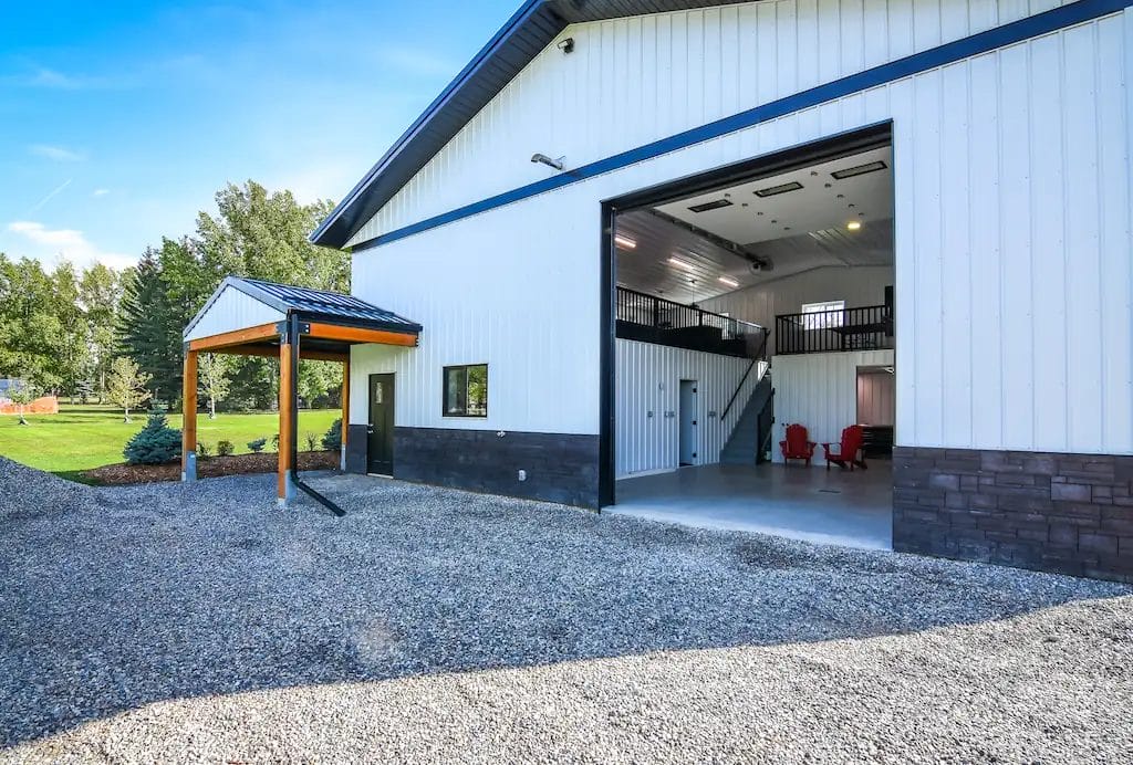 Inside of a hobby shop building can be seen through an open overhead door