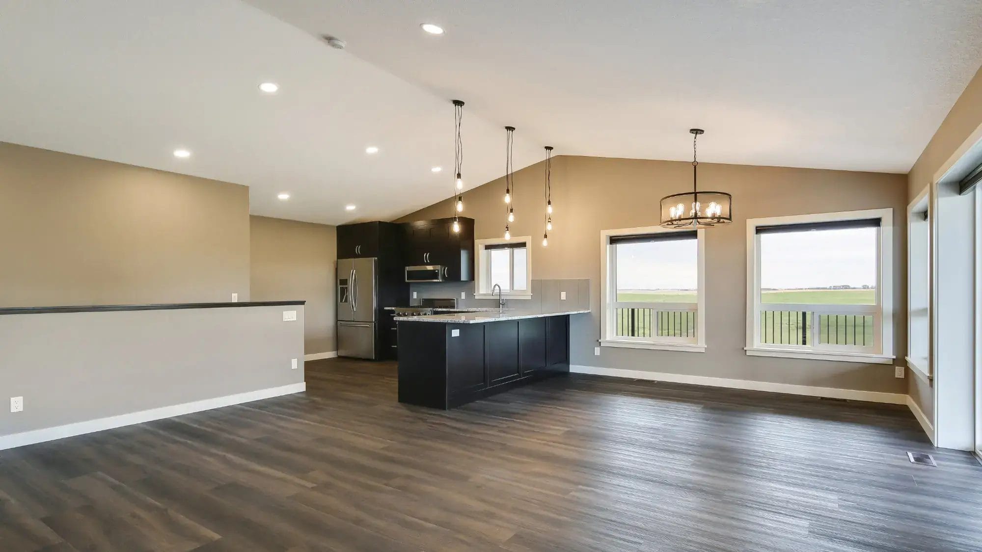 Kitchen and living space of an open-concept two story barndominium