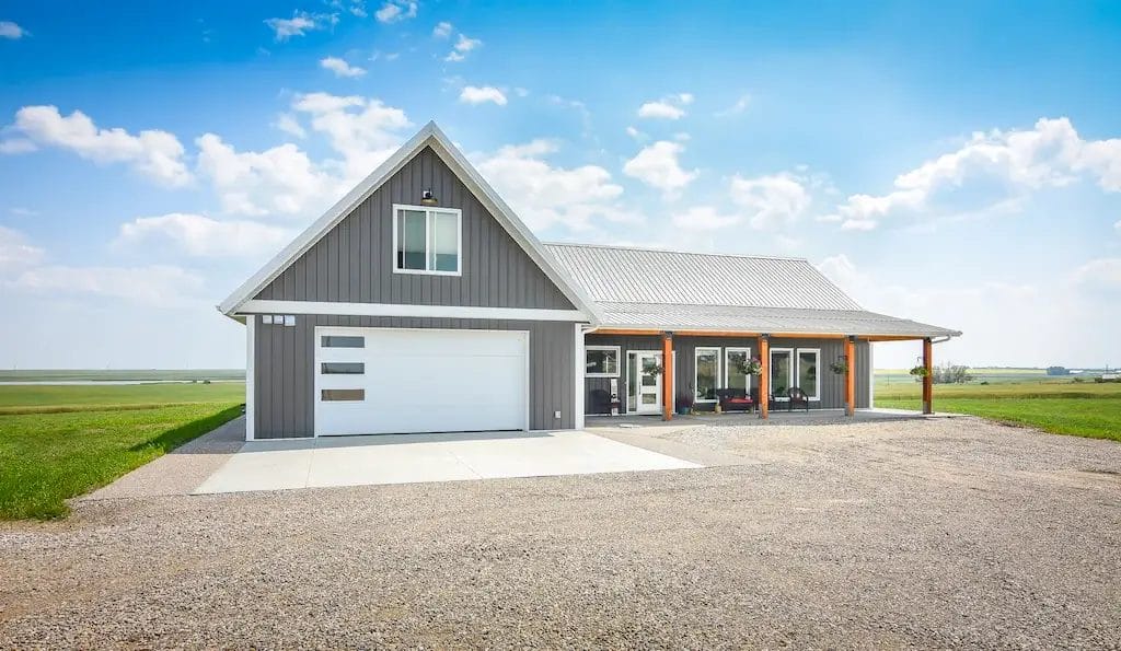 An l-shaped barndominium with attached garage