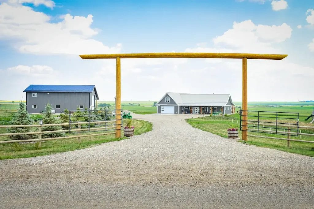 Bungalow shop home framed by a wooden arch on a country property