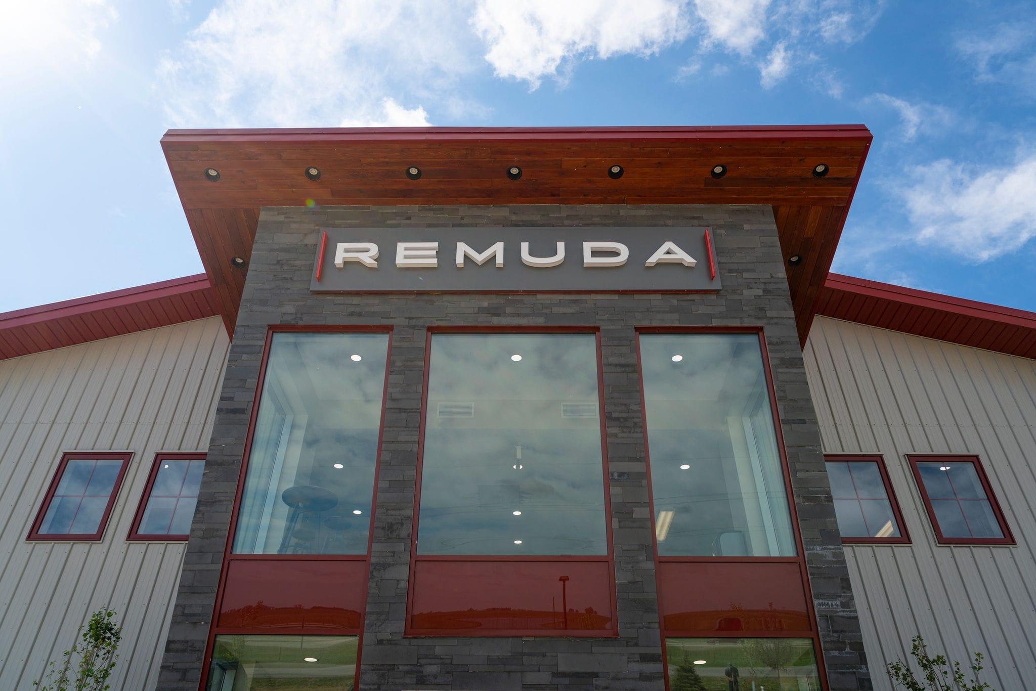 Extended post frame exterior to create a viewing area from the office space. Stone siding makes this a focal point