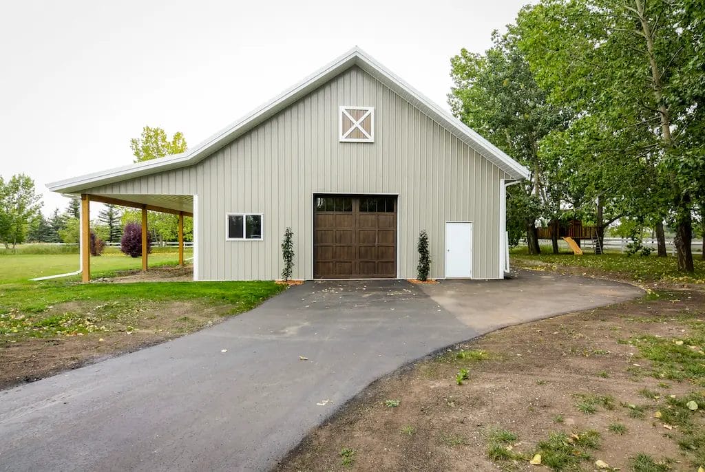 Custom 3 stall horse barn with Dutch doors and a timeless exterior aesthetic