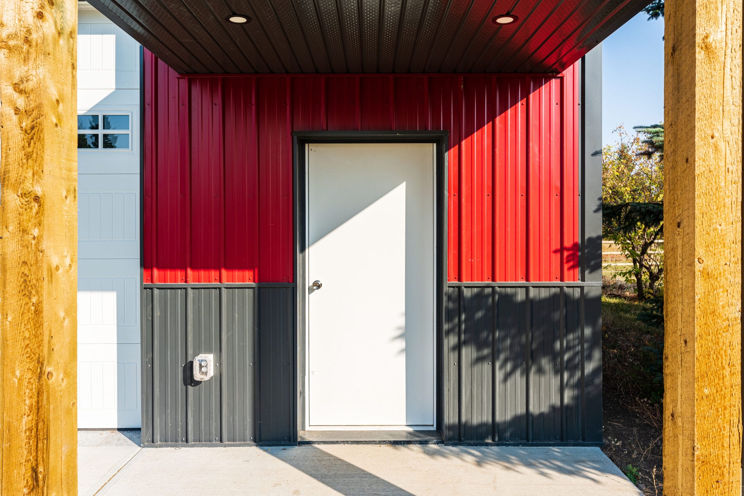 The conveniently covered from entryway to an acreage outbuilding workshop