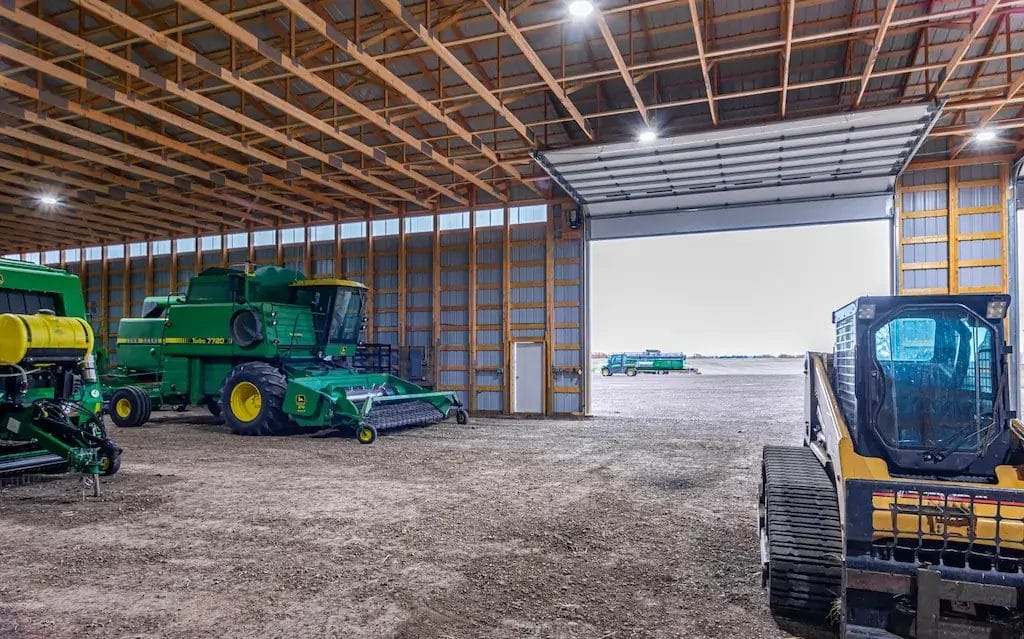 Engineered for strength, a post frame cold storage building has posts and trusses spaced at 4'
