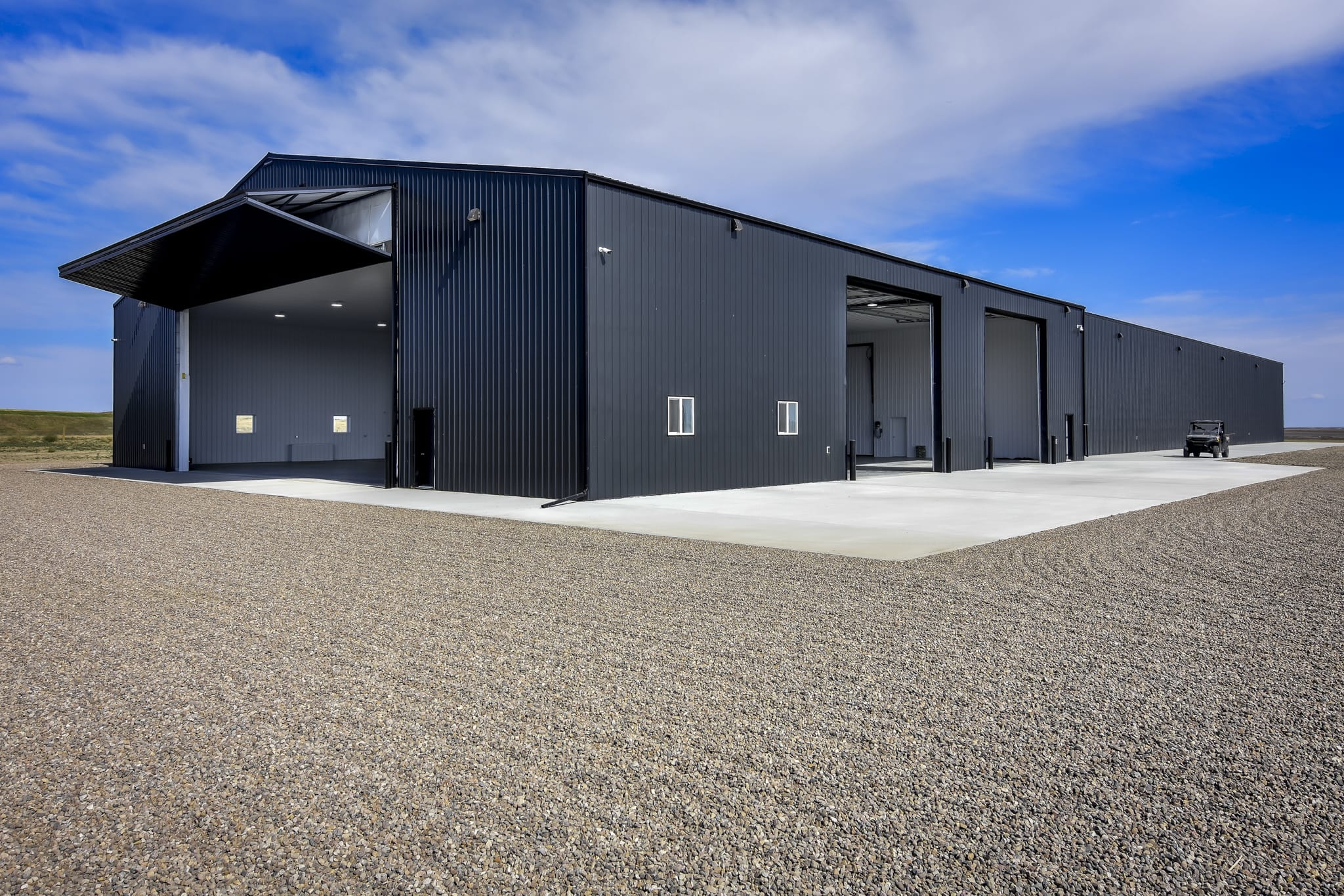 Dark exterior of a post frame farm building.
