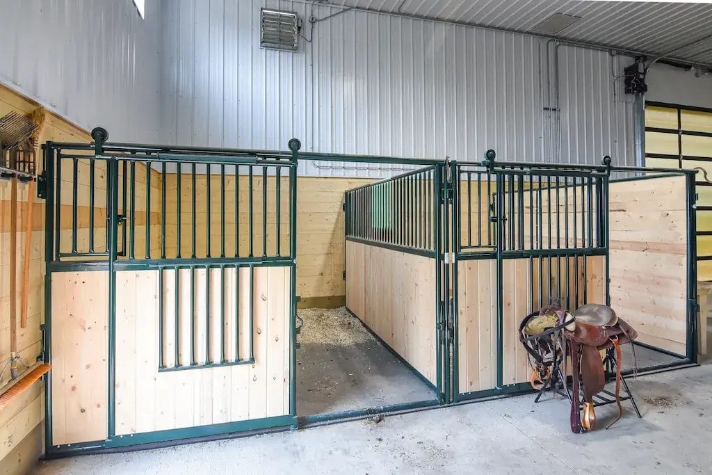 Horse stalls inside an indoor riding arena