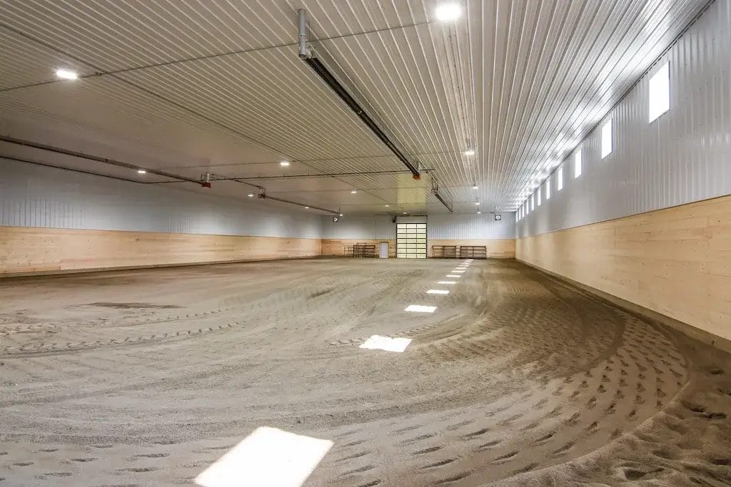 Well groomed footing inside a riding arena