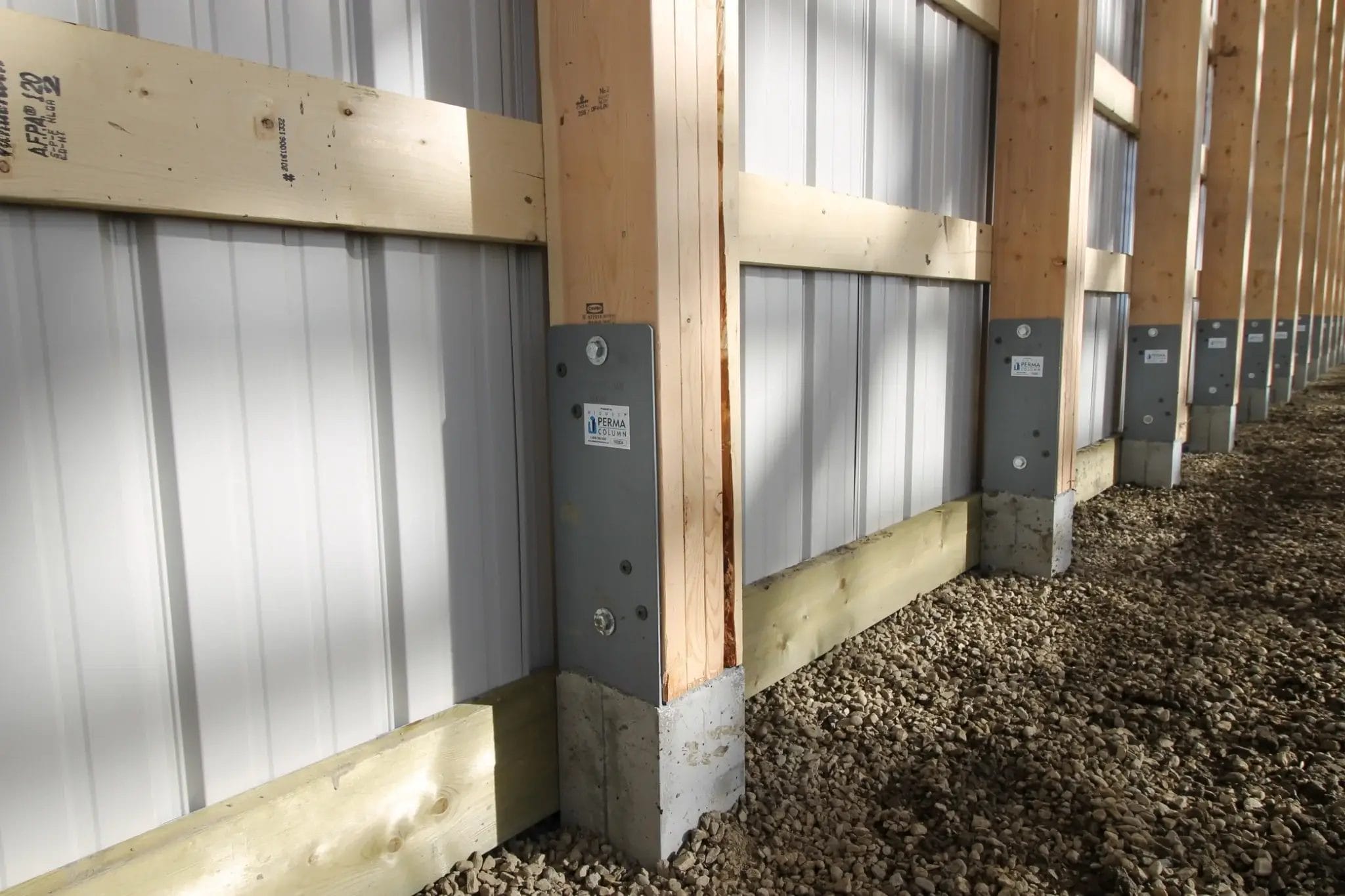 A Perma Column post foundation system added to all posts of a post frame building