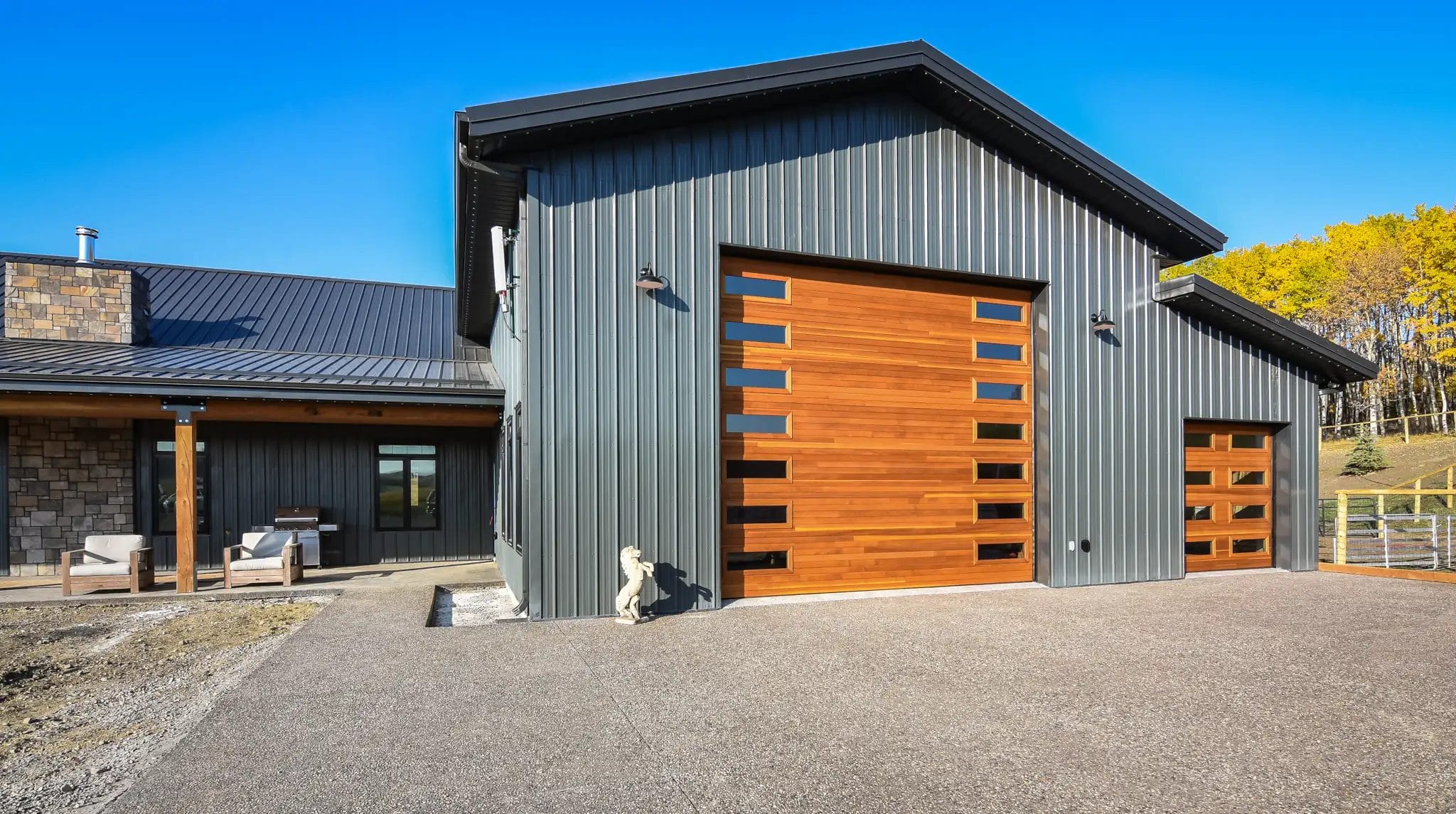 Small storage area sits to the right of the larger barndominium shop space.