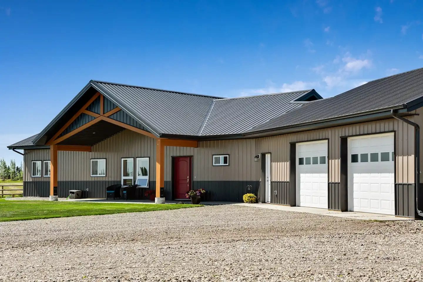 Covered entryway into an 1800 square foot barndominium with attached 2 car garage