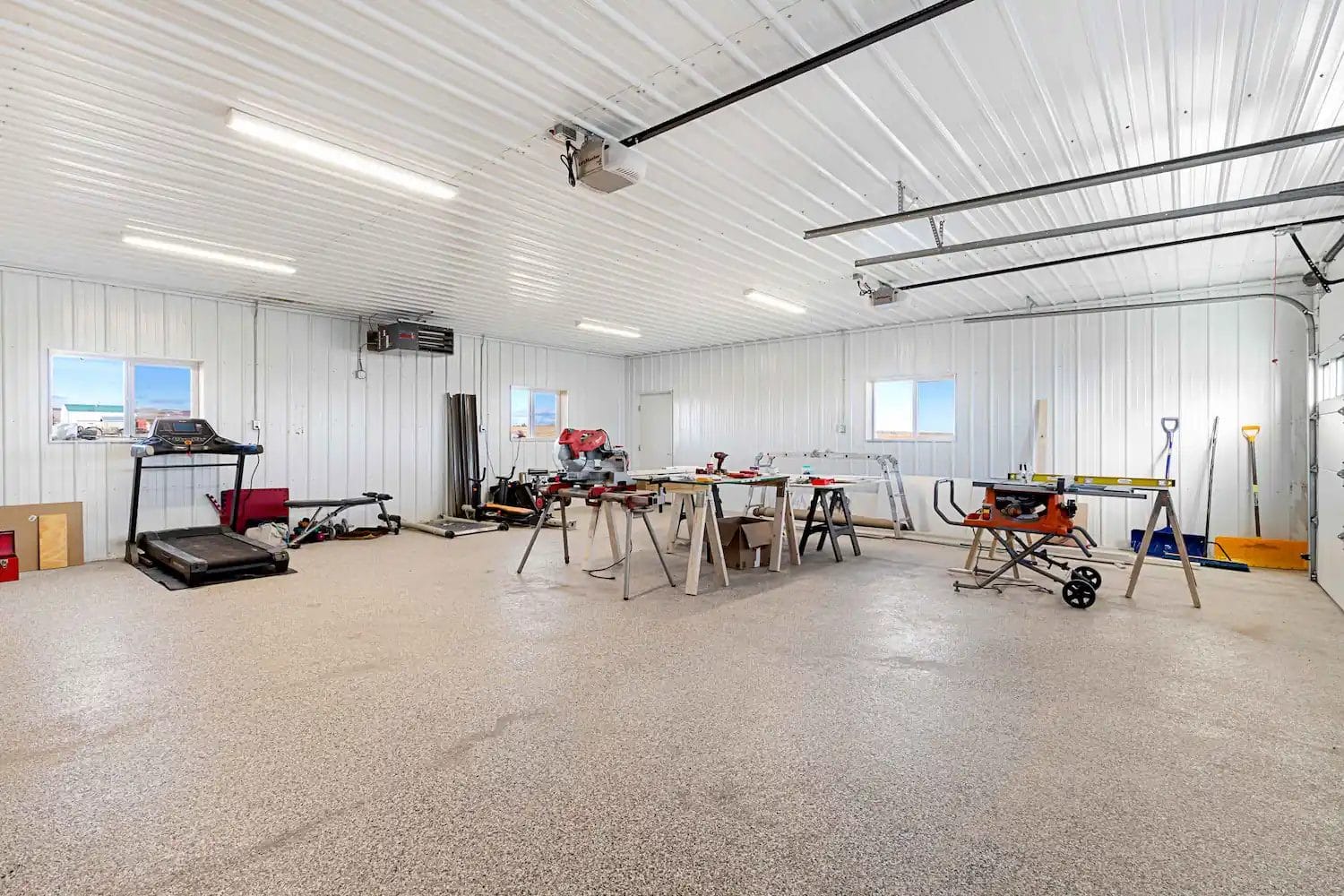 Attached 2 car barndominium garage being used as a workshop