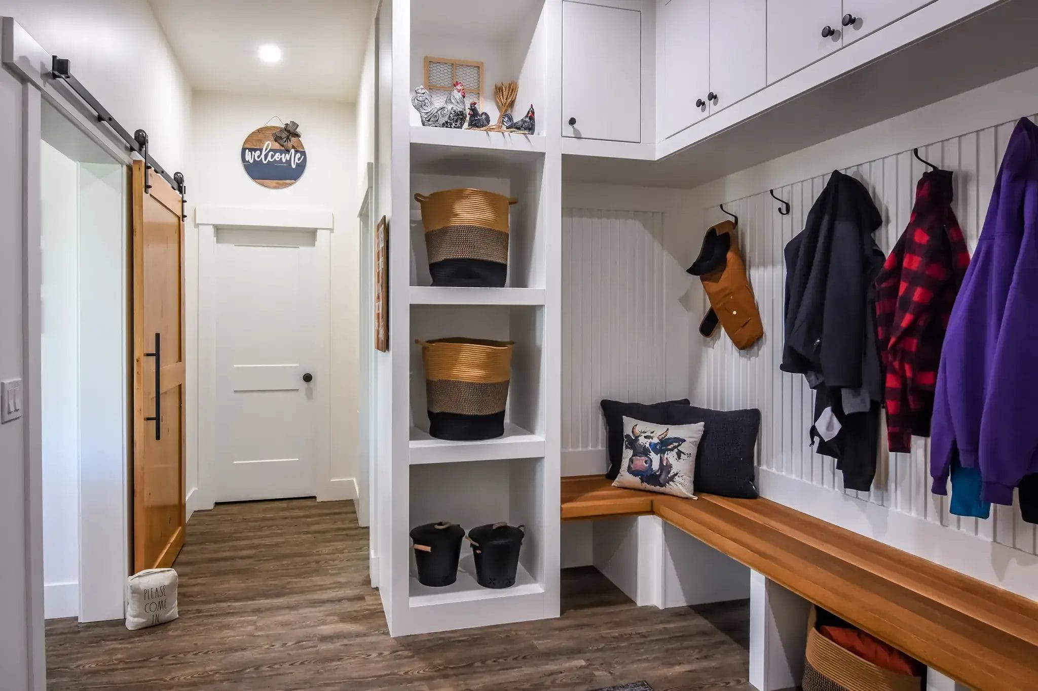 Interior mudroom separates the attached garage from living space in a 3 bedroom barndominium