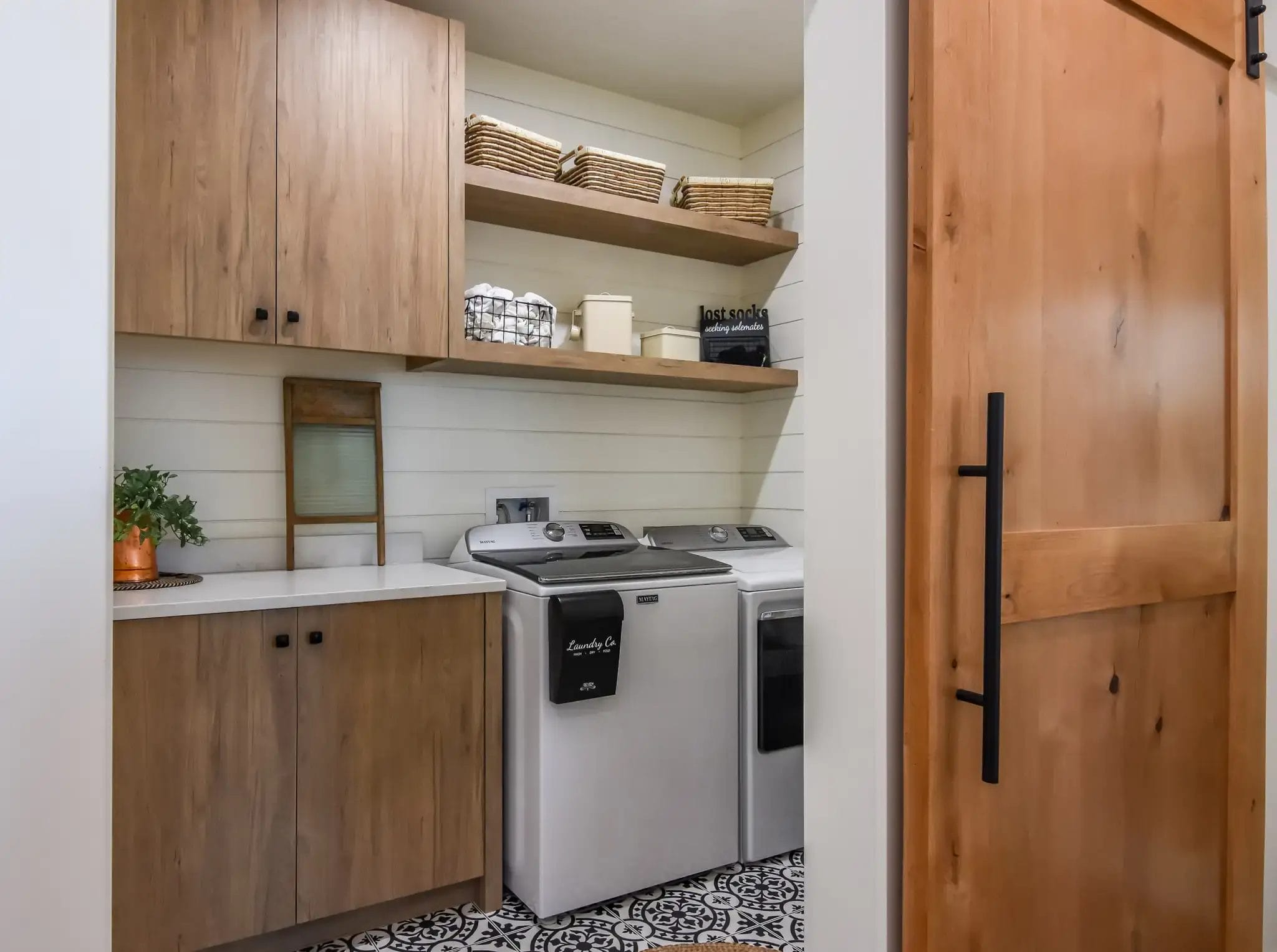 Modern laundry room in a 3 bed, 2 bath barndominium layout