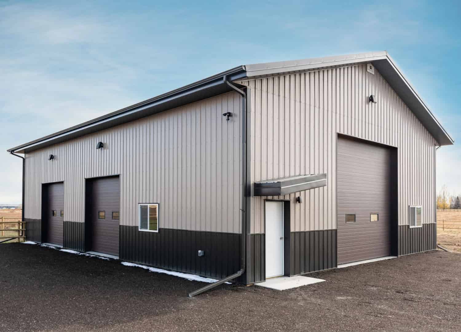 Brown Post Frame Building With Eyebrow Detail And Dark Wainscoting