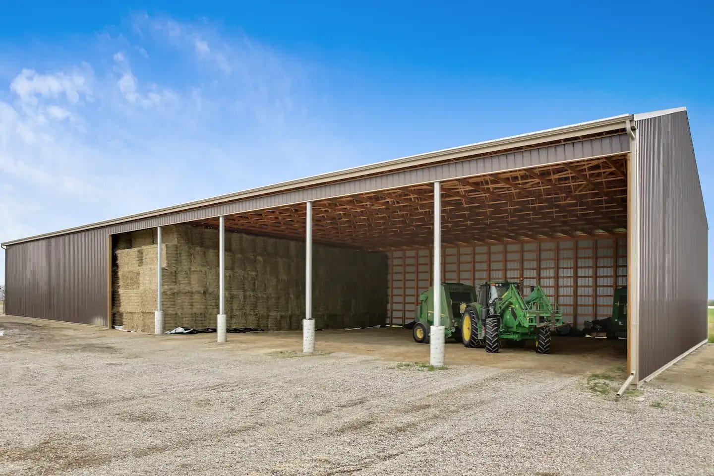 Open sided hay shed design provides hay storage and convenient access for equipment