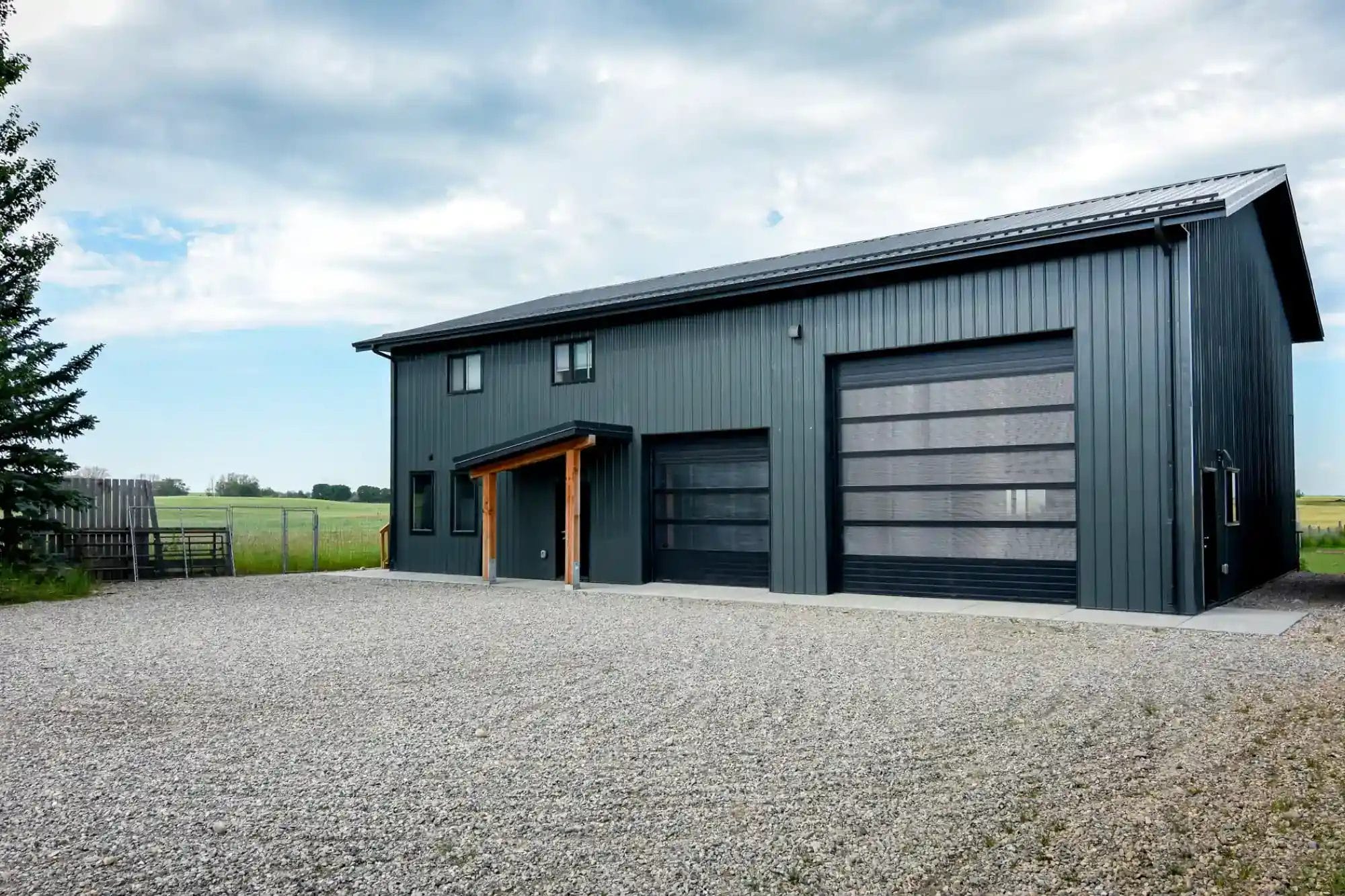 Post Frame Outbuilding With Large Overhead Doors On An Acreage